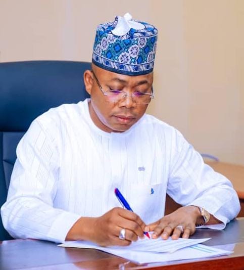 Governor of Kogi State, Usman Ahmed Ododo appending signature.