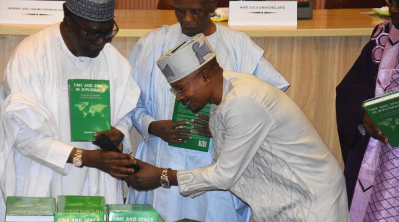 Rep. Abejide in a Handshake with Ambassador Jaiyeola Lewu