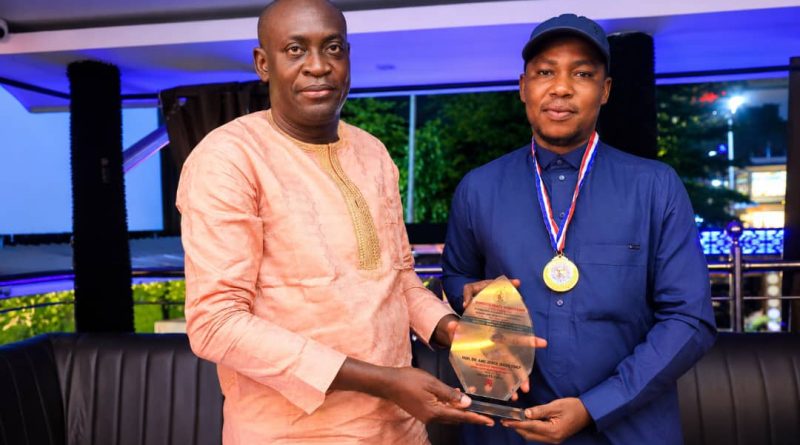 (L-R) Chief Olugbemi Femi Presenting Award Placard to Hon. Joshua Dare Monday