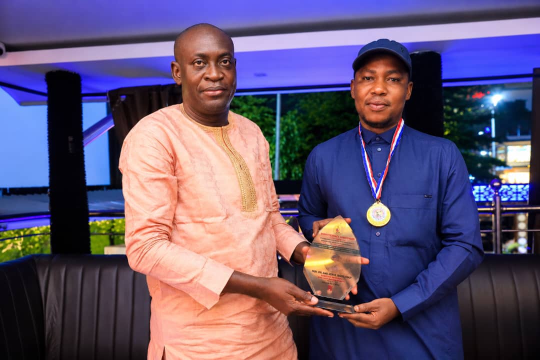 (L-R) Chief Olugbemi Femi Presenting Award Placard to Hon. Joshua Dare Monday