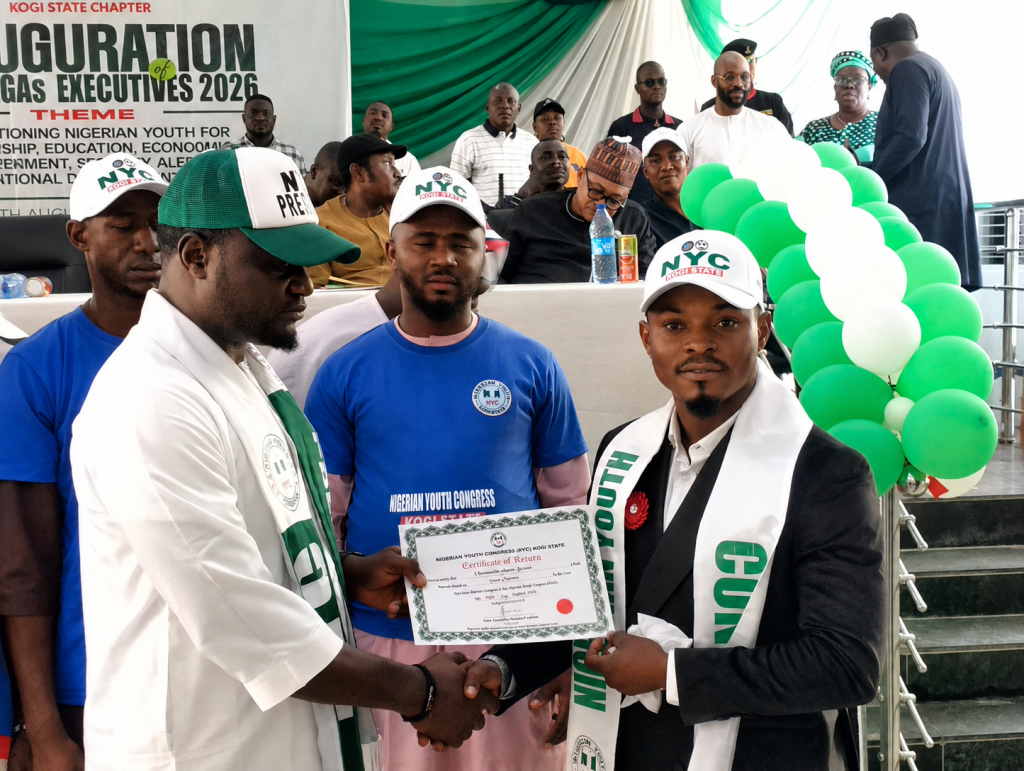 Comr. Oloruntoba Juwon receiving Certificate of Return from the National President, Engr. Jethro Annum